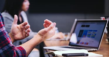 Hand gesture laptop wide.