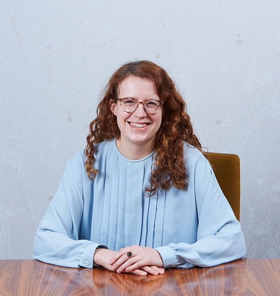 Photo of Hannah Capstick sat at table.