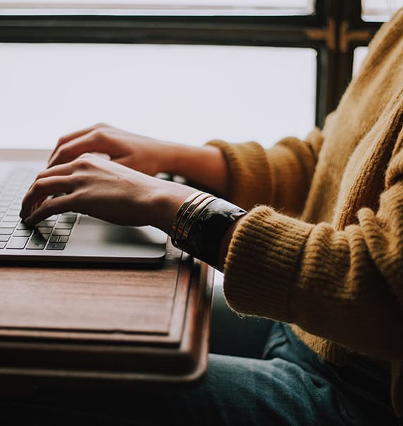 Person typing on laptop