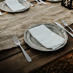 Dinner table plate set up.