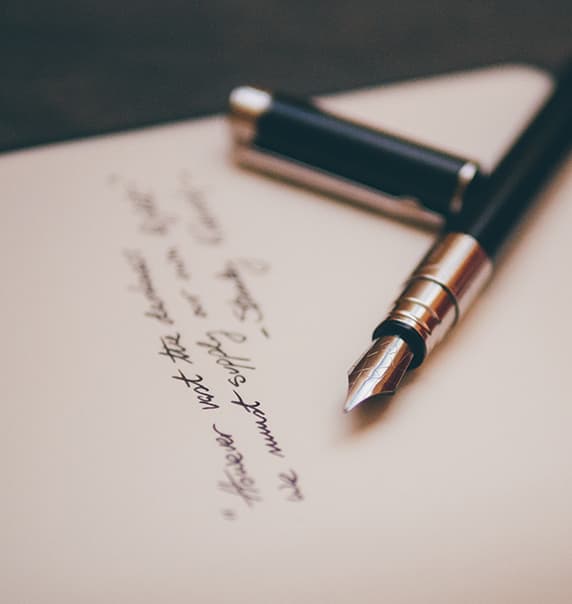 Handwritten note with pen