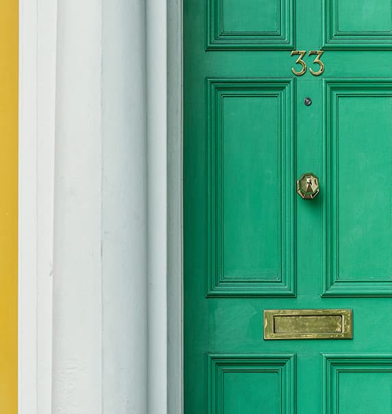 Image of green house door.