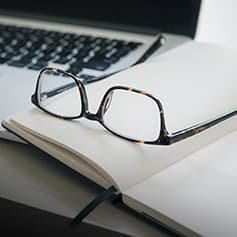 Glasses on notebook.