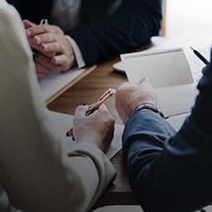 Two people discussing document.