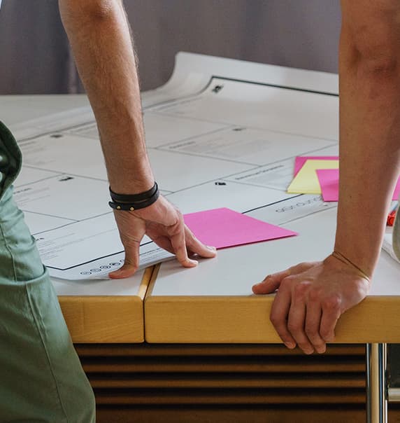 Two people looking at wall calendar