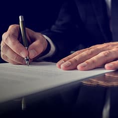 Signing contract.