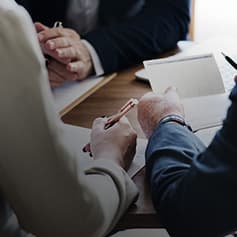 People looking at a document.