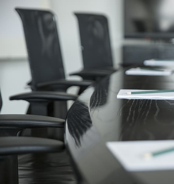 Chairs at a boardroom table.