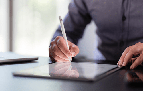 Signing on a tablet.