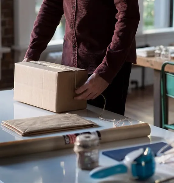 Man packing box. 
