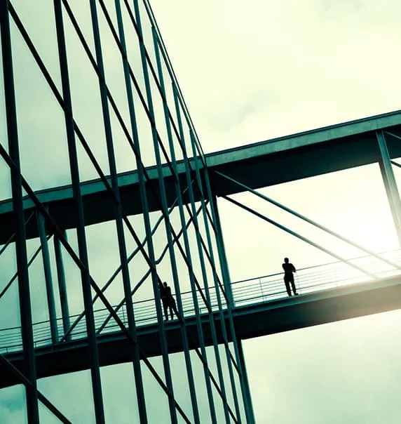 Bridge connecting glass building. 