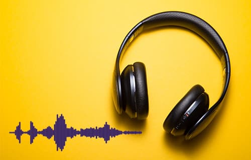 Headphones and audio wave on yellow background. 