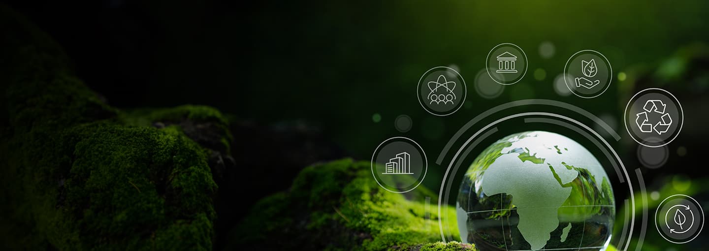 ESG illustrated globe with icons sitting on mossy stone