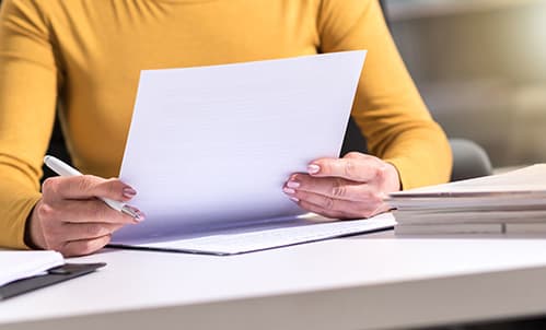 Woman looking through paperwork