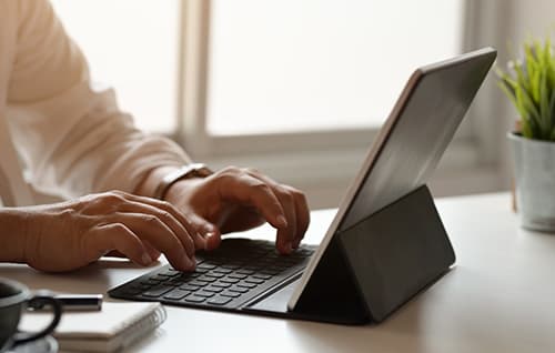 Business person on surface laptop.