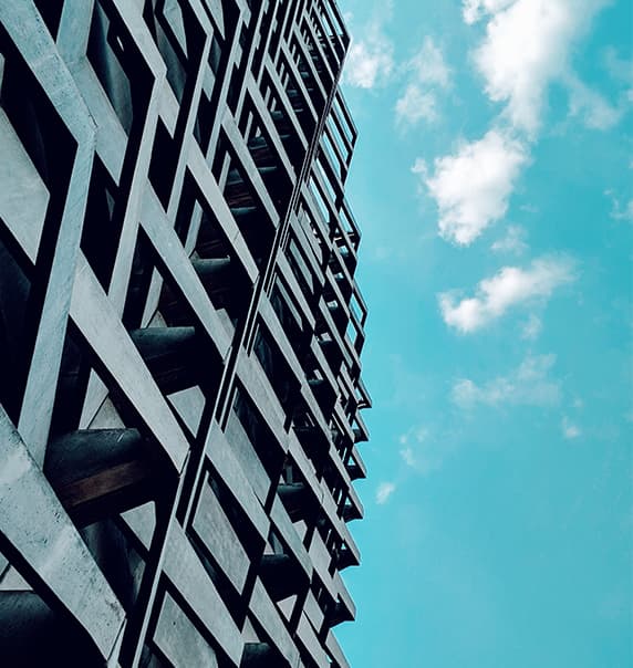 Building with blue sky and clouds.