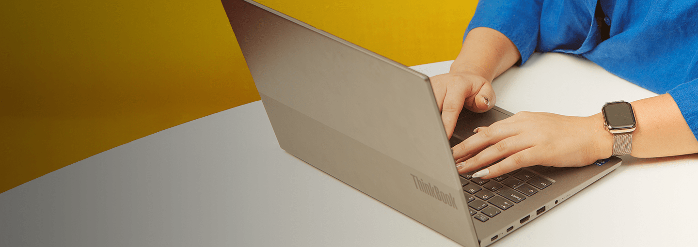 Typing on a laptop.