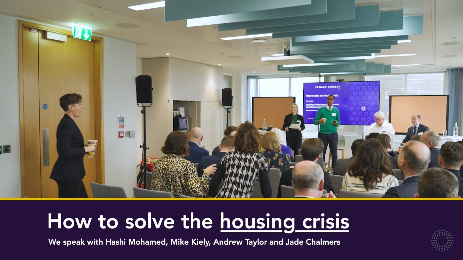 Room full of people at the how to solve the housing crisis event.